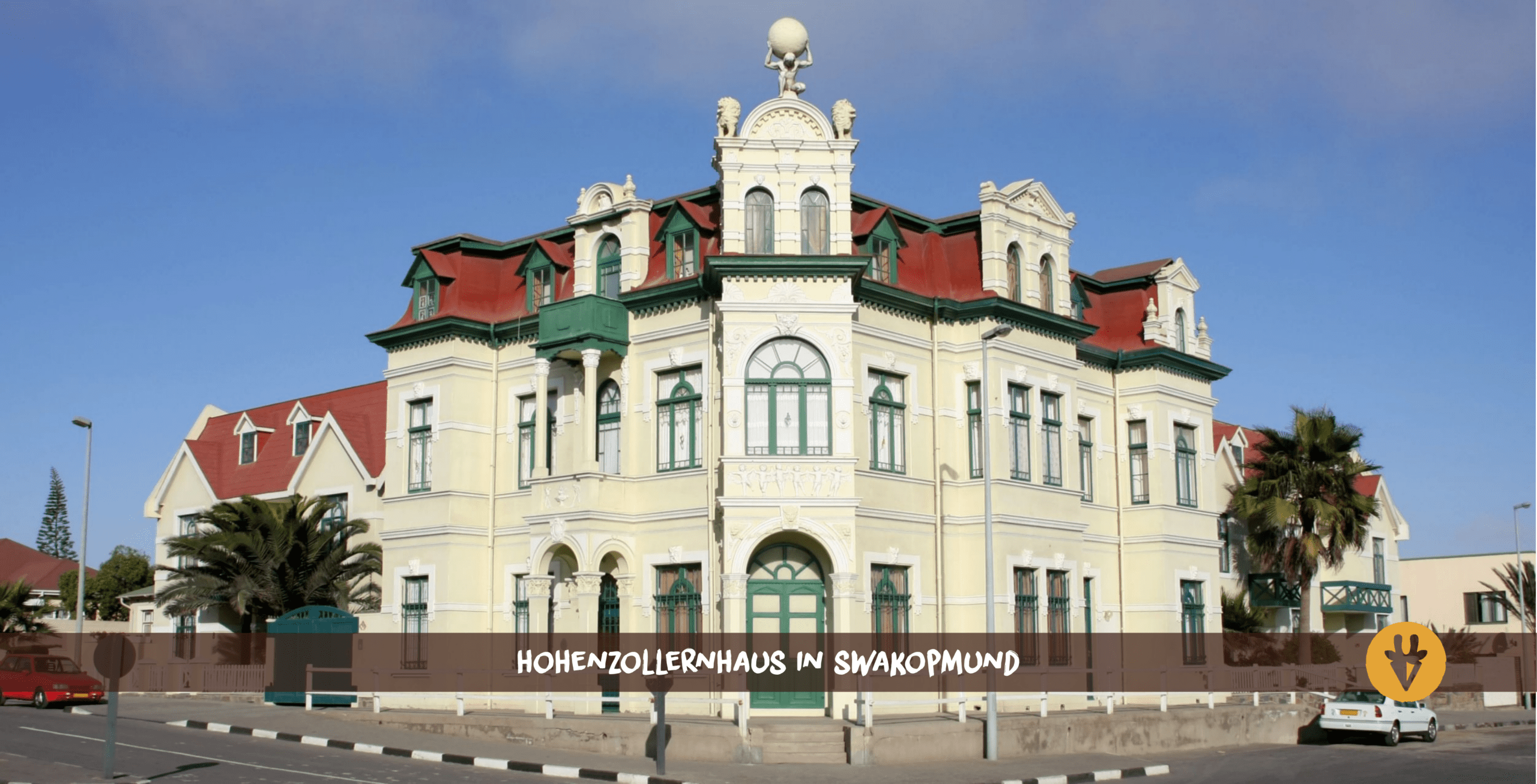 Swakopmund Hohenzollernhaus at the corner with two cars in front